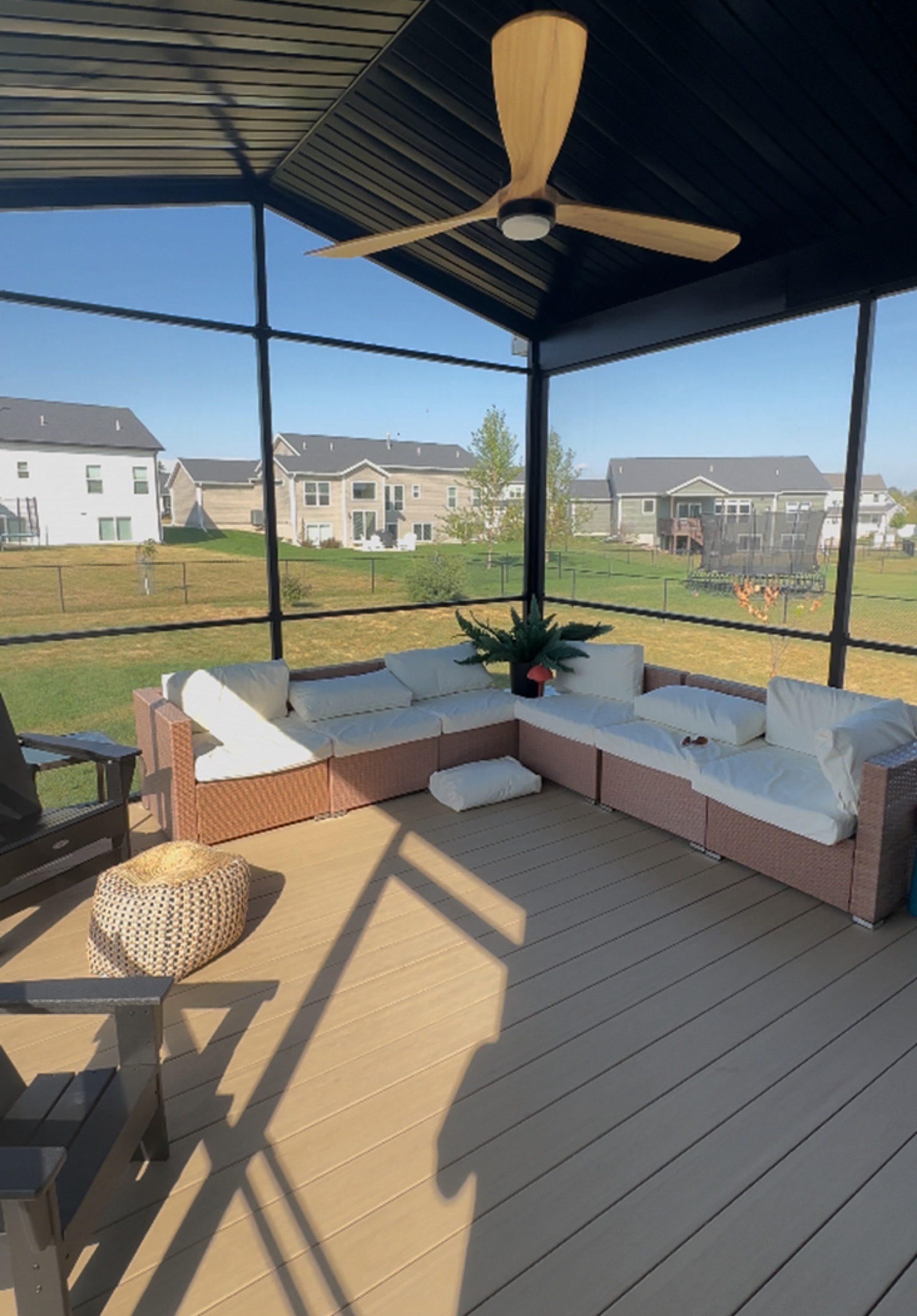 Screen room interior with ceiling fan